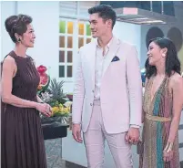  ?? SANJA BUCKO TRIBUNE NEWS SERVICE ?? Michelle Yeoh as Eleanor, Henry Golding as Nick and Constance Wu as Rachel in Crazy Rich Asians.