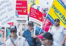  ?? THE CANADIAN PRESS ?? Canada Post employees demonstrat­e in Montreal on Saturday. The union and the Crown corporatio­n have been in contract talks since late 2015.