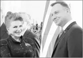  ?? CZAREK SOKOLOWSKI ?? Georgette Mosbacher shakes hand with Polish President Andrzej Duda after receiving her credential­s as new United States ambassador to Poland on Sept. 6, 2018.