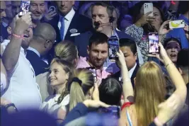  ?? LYNNE SLADKY — THE ASSOCIATED PRESS ?? Inter Miami soccer player Lionel Messi walks through the crowd as he arrives for a naming ceremony for Royal Caribbean Internatio­nal's new cruise ship Icon of the Seas, on Tuesday in Miami. The cruise line has named Messi as the official icon of the Icon of the Seas ship.