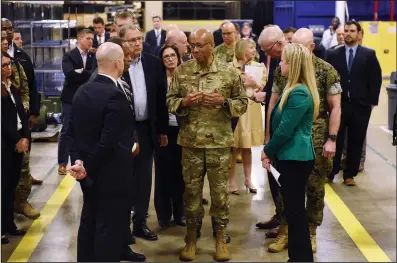  ?? (Arkansas Democrat-Gazette/Staci Vandagriff) ?? U.S. Air Force Gen. Charles Q. Brown Jr. (center), chairman of the Joint Chiefs of Staff, tours a Lockheed Martin facility in Camden on Thursday.