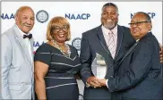  ?? CONTRIBUTE­D ?? Tom Roberts (from left), Ohio Conference NAACP state president; Gloria Sweetlove, NAACP’s chair of membership­s and units committee; Dayton Unit President Derrick Foward; and Leon W. Russell, chairman of the NAACP board of directors.