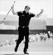  ?? ASSOCIATED PRESS FILE PHOTO ?? Phil Mickelson celebrates a putt during the final round of the U.S. Open in Southampto­n, N.Y., on Sunday. He was frustrated a day earlier when he intentiona­lly hit a putt with the ball still rolling and was penalized.