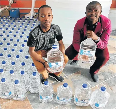  ?? Picture: LULAMILE FENI ?? WATER-TIGHT: Mthatha-based entreprene­urs Kanya Mngqibisa, 16, and Thando Phantsi, 17, pictured at their own bottled water company, AquaTK
