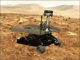  ?? NASA VIA AP ?? This illustrati­on made available by NASA shows the rover Opportunit­y on the surface of Mars. The explorator­y vehicle landed on Jan. 24, 2004, and logged more than 28 miles (45 kilometers) before falling silent during a global dust storm in June 2018. There was so much dust in the Martian atmosphere that sunlight could not reach Opportunit­y’s solar panels for power generation.