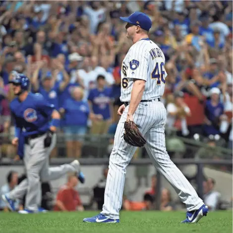  ?? BENNY SIEU / USA TODAY SPORTS ?? Brewers reliever Corey Knebel walks pinch-hitter Tommy La Stella with the bases loaded to force in a run in the 10th inning.