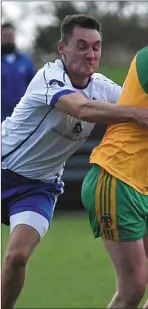  ??  ?? Stabannon’s Aonghus Giggins gets his passaway under pressure from Lannleire’s Brian McGuinness. Pictures: Colin Bell