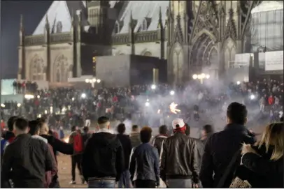  ??  ?? Chaotic scenes: Cologne on New Year’s Eve, when a large number of women were sexually assaulted