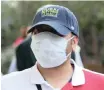  ?? | EPA-EFE ?? A SPECTATOR wears a mask at the Dubai Duty Free Tennis ATP Championsh­ips 2020 in the United Arab Emirates. The 2020 UAE Tour cycling race was cancelled.