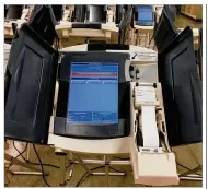  ?? LYNN HULSEY / STAFF ?? An electronic touchscree­n voting machine is set up for testing at the Montgomery County Board of Elections. It could take up to $8 million to replace Montgomery County’s more than 2,100 DRE voting machines.