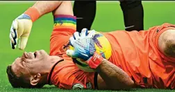  ?? ?? Floored: Emiliano Martinez is left prone after the collision