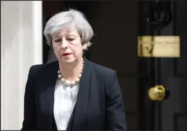  ??  ?? A drawn-looking Prime Minister Theresa May outside No 10 Downing Street