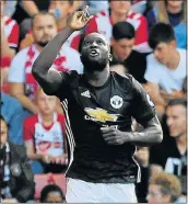  ?? Picture: REUTERS ?? SINGERS’ TARGET: Manchester United’s Romelu Lukaku celebrates scoring against Southampto­n