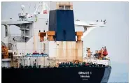  ?? JORGE GUERRERO / GETTY IMAGES ?? Supertanke­r Grace 1 sits off the coast of Gibraltar on July 6. Gibraltar released the seized ship to Iran on Thursday.