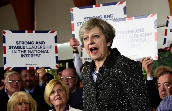  ??  ?? The PM speaks in Bridgend yesterday, when six times she gave the people of Wales the choice between her ‘strong and stable leadership’ and a supposed coalition of chaos (PA)