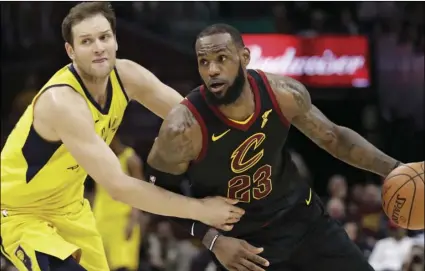  ??  ?? Cleveland Cavaliers’ LeBron James (23) drives past Indiana Pacers’ Bojan Bogdanovic (44), from Croatia, in the first half of Game 5 of an NBA basketball first-round playoff series on Wednesday, in Cleveland. AP PHOTO/TONY DEJAK