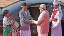  ?? Reuters ?? WARM GREETINGS: Nepal’s Prime Minister K.P. Sharma Oli, second left, shakes hands with his Indian counterpar­t Narendra Modi, second right, as his wife Radhika Shakya Oli, left, gestures at Oli’s ceremonial reception at the forecourt of India’s...