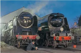  ?? MARTYN TATTAM ?? A dawn start at Loughborou­gh shed, just after 7am on January 29, as BR 9F No. 92214 City of Leicester and Bulleid No. 24072 257 Squadron are prepared for service.