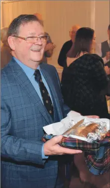  ?? 50_c05burnssu­pper02 ?? Alistair Mackay carried the haggis as it was piped in.