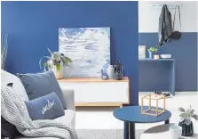  ?? Photo / Wendy Fenwick ?? Styled by Vanessa Nouwens, this lounge leads into the hallway using variations of blue to create a sense of continuity. The walls are painted Resene Zinzan while Biscay and Half Dusted Blue have been used in the hall.