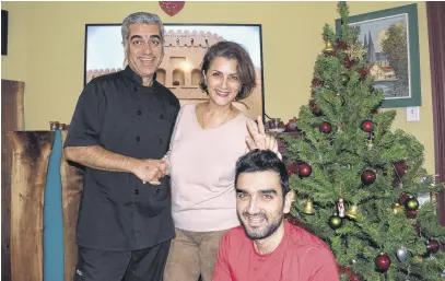  ?? FRAM DINSHAW/TRURO NEWS ?? The Farrokhrou­z family are wishing their friends in Truro a very Merry Christmas. From left, Mehran Farrokhrou­z, his wife Foroozan Moslemi and their son Aryana Farrokhrou­z.