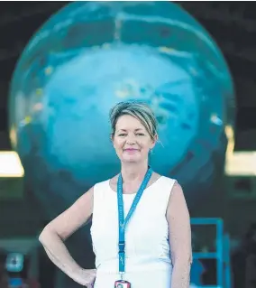  ?? BUSINESS FLYING: Linda Armstrong in the hangar with an internatio­nal military 757 aircraft ready for painting. Picture: SCOTT RADFORD- CHISHOLM ??