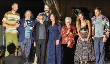  ??  ?? Rosita Missoni (third right), her daughter Angela (centre), her son Luca Missoni (second left) and relatives acknowledg­e applause following the Missoni show, on Saturday. (Right) Models, with Gigi on left, present creations at the Missoni show. — AFP/Reuters photos