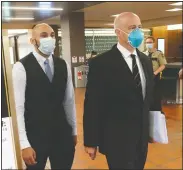  ?? (AP/Jim Mone) ?? Former Minneapoli­s Police Officer J. Alexander Kueng (left) enters the Hennepin County Government Center in Minneapoli­s Tuesday with his attorney Thomas Plunkett for a hearing. Kueng is one of four officers, who were fired after George Floyd’s May 25 death.