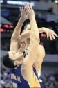  ?? Ron Jenkins Associated Press ?? LAKERS’ Larry Nance Jr. takes it on the chin as he fouls Salah Mejri.