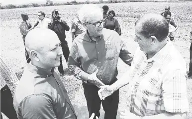  ?? RUDOLPH BROWN/PHOTOGRAPH­ER ?? Minister of Finance Audley Shaw (right) chats with Mark Haskins (centre), CB Group CEO; and Matthew Lyn, COO of the CB Group, at the groundbrea­king for ‘The Nest’ last Friday.