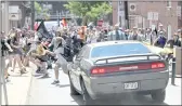  ?? RYAN M. KELLY — THE DAILY PROGRESS ?? A vehicle drives into a group of protesters demonstrat­ing against a white nationalis­t rally on Aug. 12, 2017, in Charlottes­ville, Va.