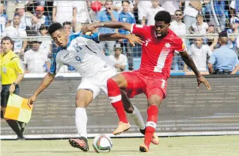  ?? THE ASSOCIATED PRESS ?? Honduras’ Anthony Lozano and Canada’s Simeon Jackson fight for the ball during their World Cup qualifier match Friday. Canada faces an unlikely path to qualifying after losing 2-1 to Honduras.