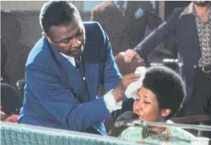  ??  ?? Aretha Franklin’s father, the Rev. C.L. Franklin, mops her brow in a scene from Amazing Grace. In 2015, she won an injunction to block the first public screenings of the film.