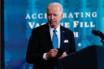  ??  ?? President Joe Biden leaves an event with Johnson and Johnson Chairman and CEO Alex Gorsky, and Merck Chairman and CEO Kenneth Frazier in the South Court Auditorium in the Eisenhower Executive Office Building on the White House Campus, Wednesday, March 10, 2021, in Washington. (AP Photo/Andrew Harnik)