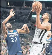  ?? DARREN ABATE — THE ASSOCIATED PRESS ?? LaMarcus Aldridge, right, scored 39 points to help the Spurs get past Andrew Wiggins and the Timberwolv­es.