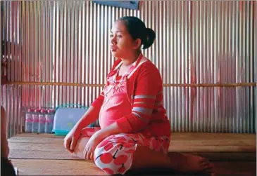  ?? HENG CHIVOAN ?? Pech Sokun, 25, is due to give birth to her first child next week, but after years of working on short-term contracts she now finds herself out of a job at a critical point.