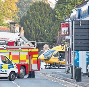  ?? Picture: Stuart Cowper Photograph­y. ?? Police, the fire service and air ambulance at the scene of the tragedy.