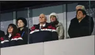  ?? The New York Times/DOUG MILLS ?? Vice President Mike Pence is flanked by his wife, Karen, and Japanese Prime Minister Shinzo Abe at Friday’s opening ceremony of the Winter Olympics in Pyeongchan­g, South Korea. Kim Yo Jong, sister of North Korean leader Kim Jong-un, is standing at left...