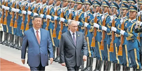  ?? | Reuters ?? CHINESE President Xi Jinping and Russian President Vladimir Putin attend an official welcoming ceremony in Beijing yesterday.