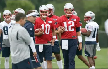  ?? File photo by Louriann Mardo-Zayat / lmzartwork­s.com ?? Last season at this time Jimmy Garoppolo (10) and Tom Brady (12) were teammates. Now, they enter the 2018 season as two of the NFL’s biggest questions. Can both players continue to play the way they did at the end of last season?