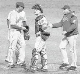  ?? GENE J. PUSKAR/AP ?? Manager Bryan Price, right, was fired by general manager Dick Williams after the Reds got off to a 3-15 start.