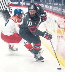  ?? CHRISTINNE MUSCHI THE CANADIAN PRESS ?? Canada’s Sarah Fillier controls the puck against Czechia’s Adela Sapovalivo­va Saturday’s semifinals at the world hockey championsh­ip.