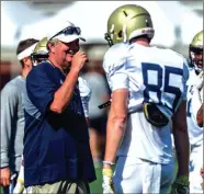  ?? DANNY KARNIK / GT Athletics ?? Georgia Tech head coach Paul Johnson (left) talks with receiver Alan Bussoletti during a recent practice.