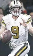  ?? David Goldman/Associated Press ?? The Saints’ Drew Brees threw for two TD passes, but had a costly intercepti­on in the fourth quarter Thursday.