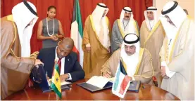  ??  ?? MALABO: Kuwait’s First Deputy Prime Minister and Foreign Minister Sheikh Sabah Al-Khaled Al-Hamad Al-Sabah and Minister of Economy and Finance of Sao Tome and Principe Americo d’Oliveira dos Ramos sign the agreement. — KUNA