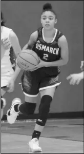  ?? Photo by Alexis Meeks ?? Bismarck’s Kady Pleasants looks to pass the ball during a recent Lady Lions game.