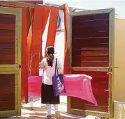  ?? Religion News Service ?? An Orthodox Jewish girl enters Tel Aviv’s “religious” beach, one of a dozen gender-segregated beaches in Israel.