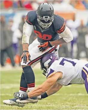  ?? | JONATHAN DANIEL/GETTY IMAGES ?? Ailing defensive end Julius Peppers was limited to one tackle in the Bears’ victory Sunday against the Vikings at Soldier Field.