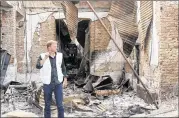  ?? NAJIM RAHIM / AP ?? Christophe­r Stokes, the general director of the medical charity, Doctors Without Borders, which is also known by its French abbreviati­on MSF, stands amid the charred remains of the organizati­on’s hospital.