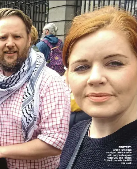  ?? ?? Protest: Green TD Neasa Hourigan takes a selfie with party colleagues Hazel Chu and Patrick Costello outside the Dáil this week